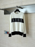 Dior crewneck sweater in cream with black ribbed hem/cuffs and DIOR logo