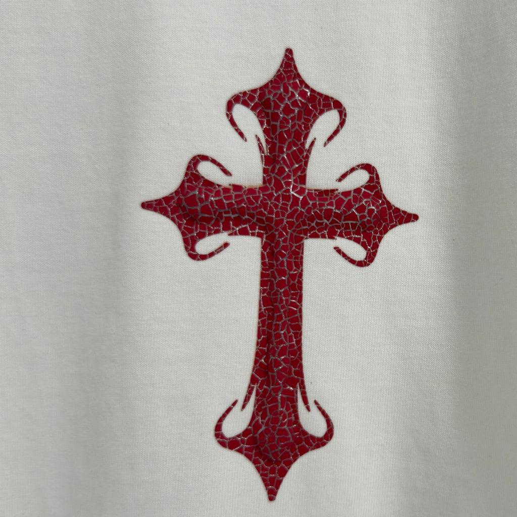 Red cross graphic on white T-shirt front