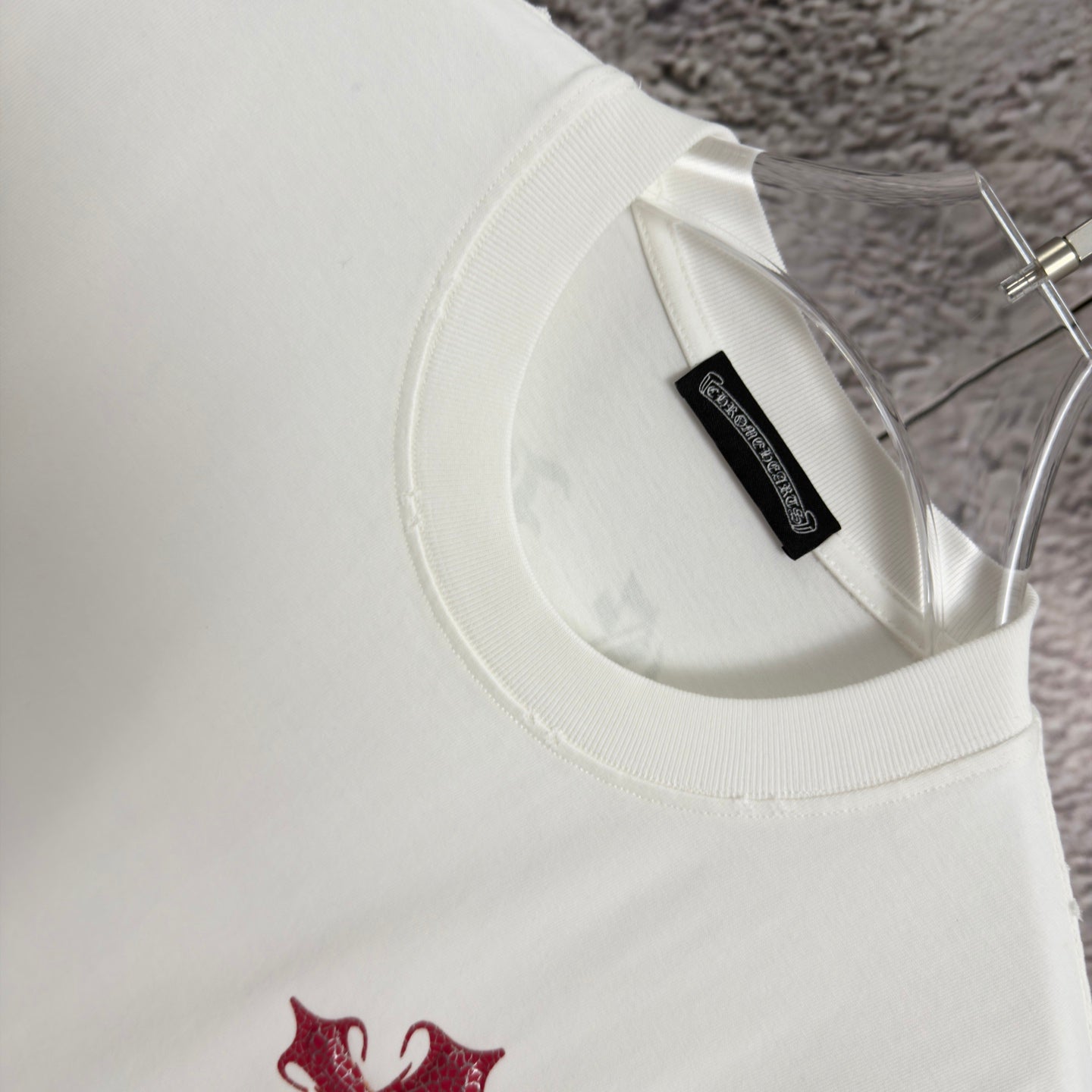 White T-shirt neckline and inner neck label with black tag