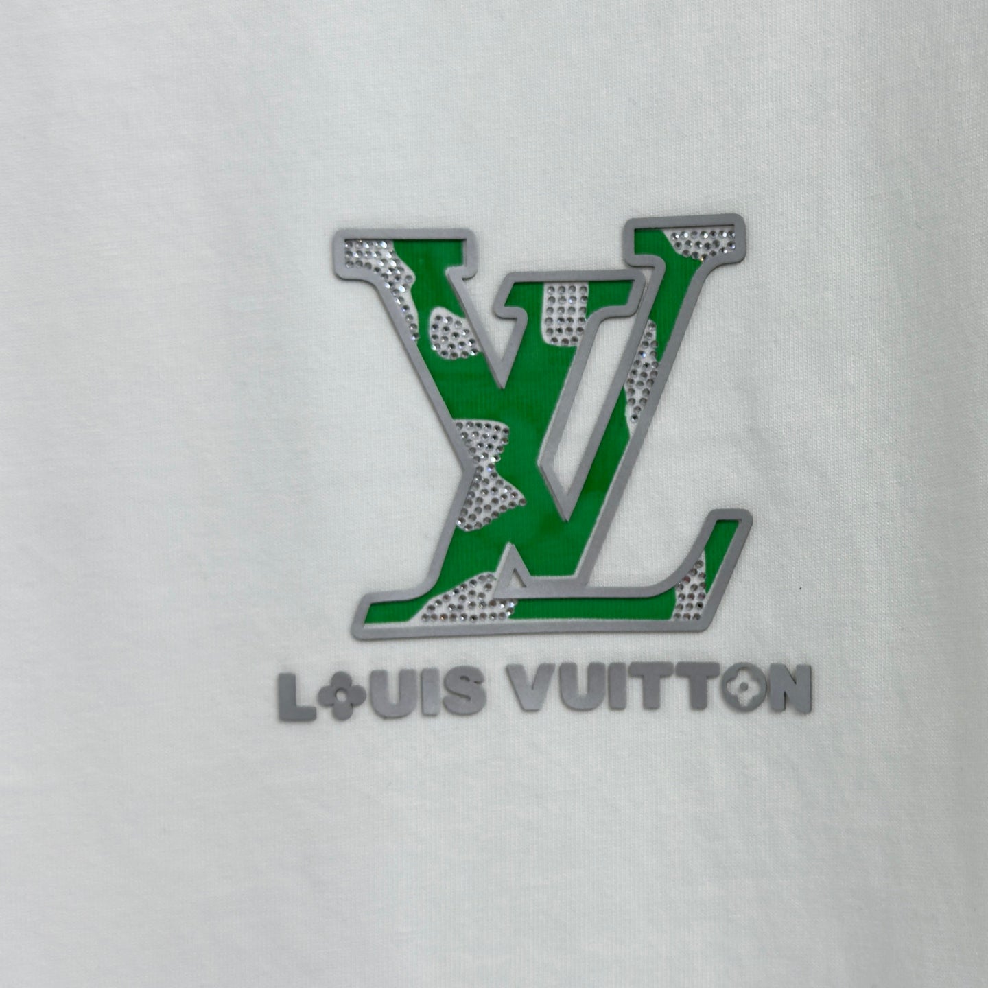 White T-shirt chest with large green and white LV logo applique