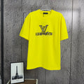 Louis Vuitton yellow T-shirt with LV logo graphic on front