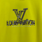 Louis Vuitton yellow T-shirt with large LV logo and slogan print