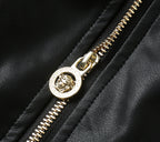 Leather jacket zipper with gold-toned Versace pull