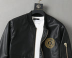 Black leather jacket front on hanger with white crew neck and gold logo patch