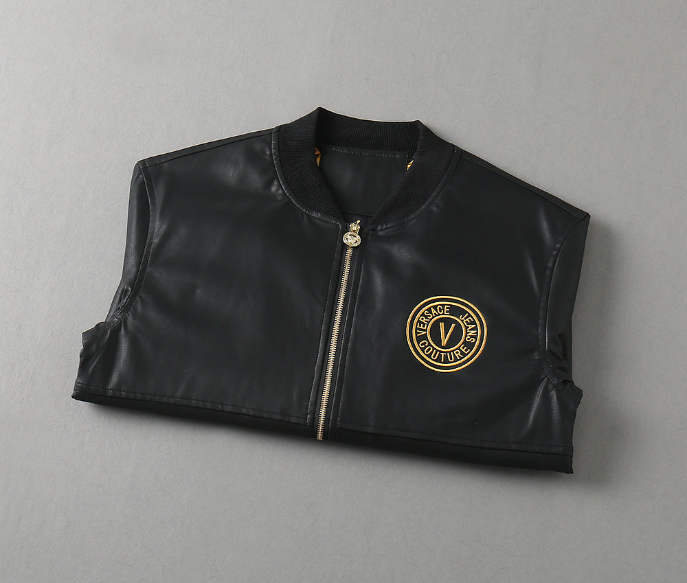 Black leather zip vest with gold emblem on the chest and standing collar