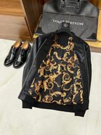 Black leather jacket back with ornate gold baroque-style lining print