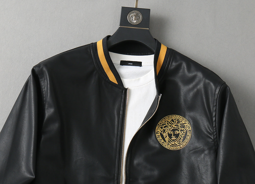 Black leather bomber jacket with gold-trimmed collar, front zipper, and chest logo