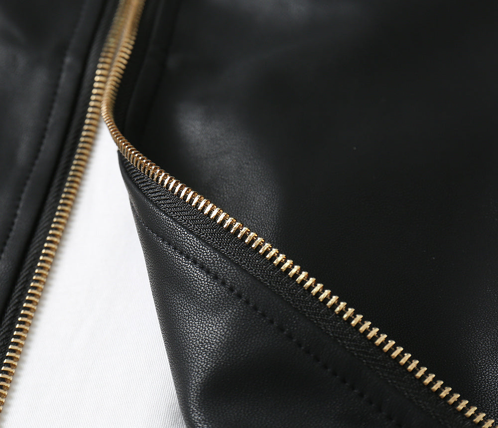 Black leather jacket zipper with gold-tone metal teeth