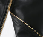 Black leather jacket zipper with gold-tone metal teeth