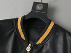 Black leather bomber jacket neckline with gold stripe trim and front zipper ring