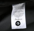 Black and white clothing label reading Fashion and COMFORT