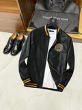 Black leather bomber jacket with gold medallion logo on the chest and zip front