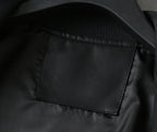 Black leather bomber jacket with visible interior patch pocket