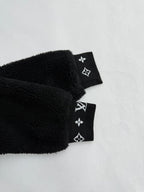 Black sherpa jacket cuffs with Louis Vuitton monogram band