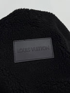 Black sherpa jacket with Louis Vuitton rectangular brand label