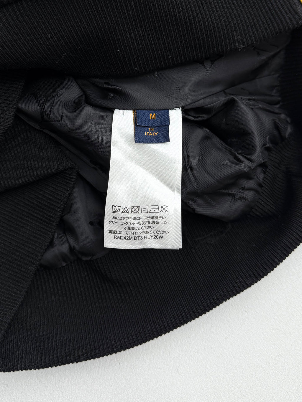 Black Louis Vuitton jacket lining with size tag on ribbed interior collar