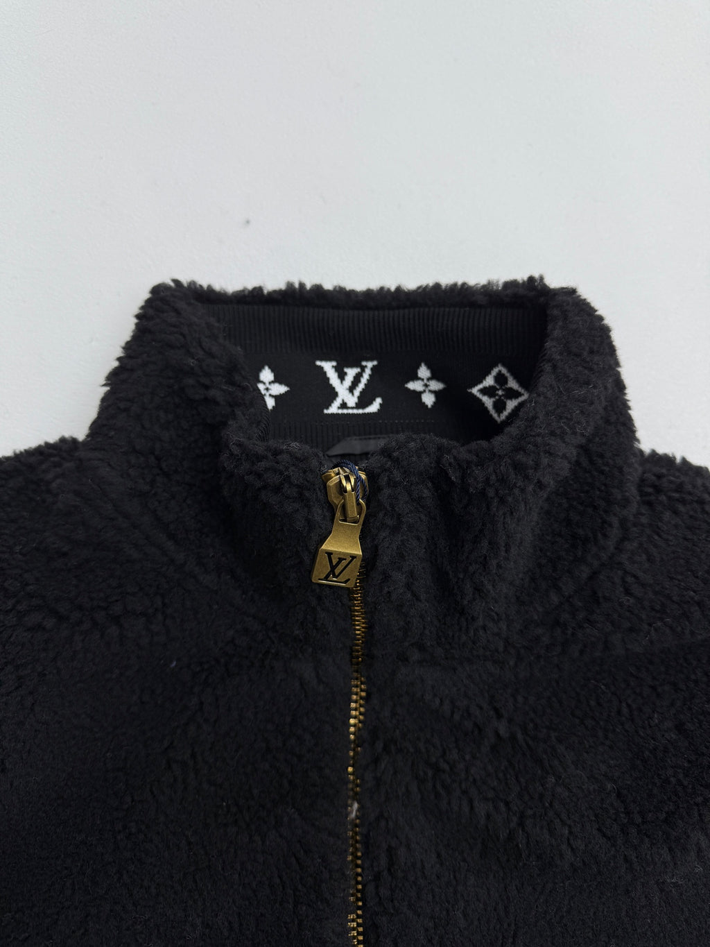 Black sherpa jacket collar with Louis Vuitton monogram placket