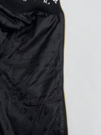 Black Louis Vuitton satin lining with monogram pattern and gold zipper