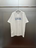 White short-sleeve crewneck T-shirt with blue Dior graphic on chest