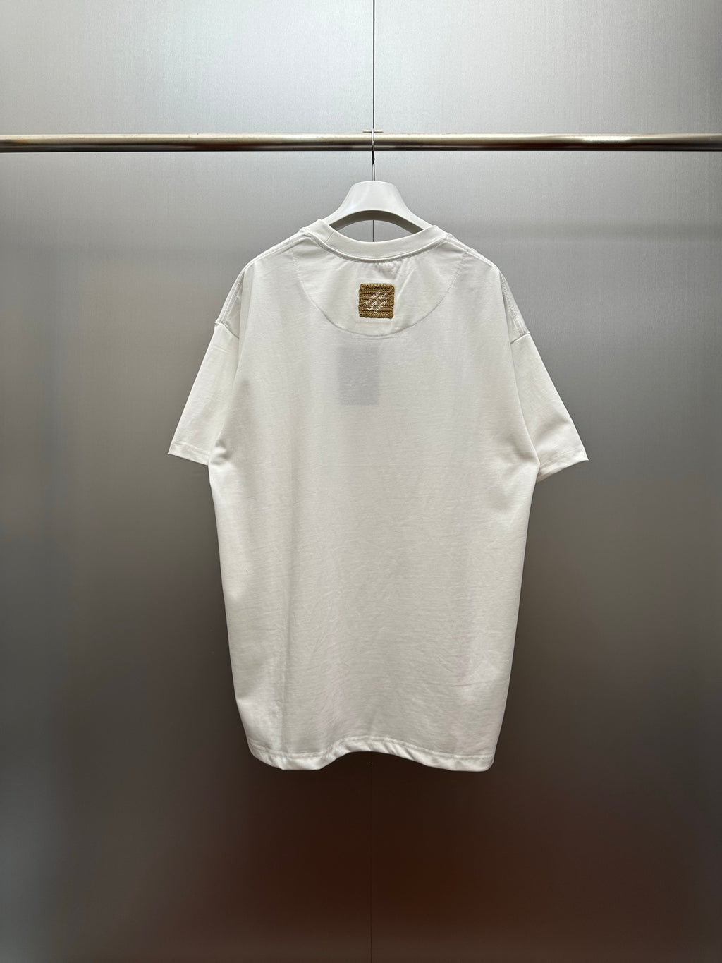 Louis Vuitton white short-sleeve shirt with small chest patch detail on back