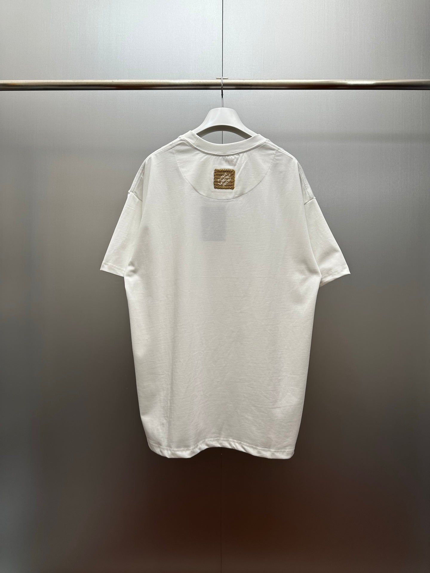 Louis Vuitton white short-sleeve shirt with small chest patch detail on back