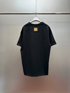 Louis Vuitton black short-sleeve T-shirt, small gold logo patch on upper back
