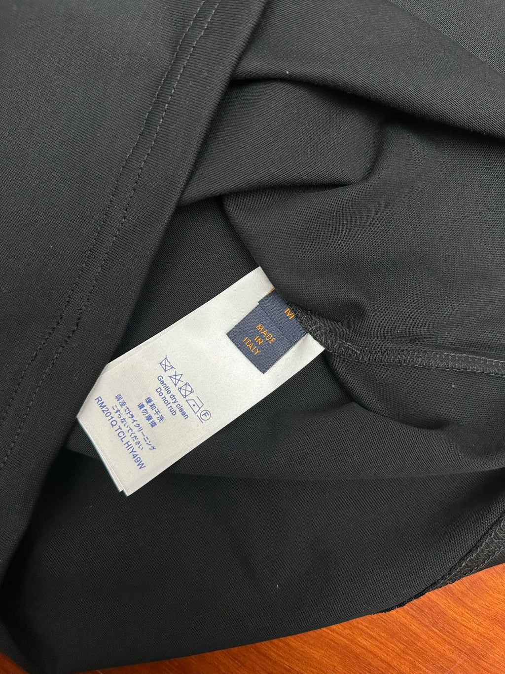 Louis Vuitton T-shirt with inner neck label and care tag, black fabric close-up