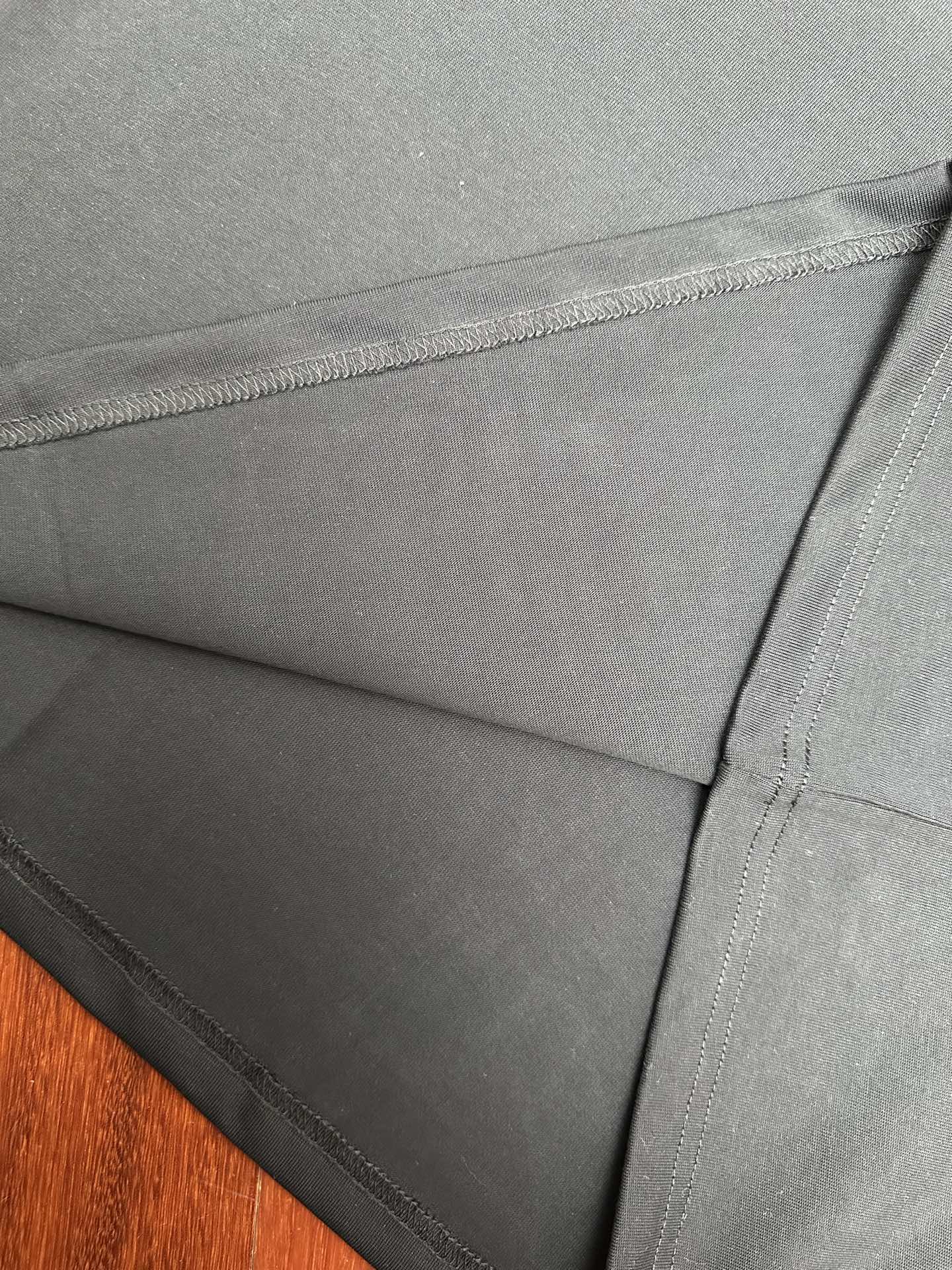 Louis Vuitton black T-shirt fabric and stitched hem seam detail