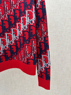Dior knit sweater side view: red and navy logo knit with ribbed hem detail