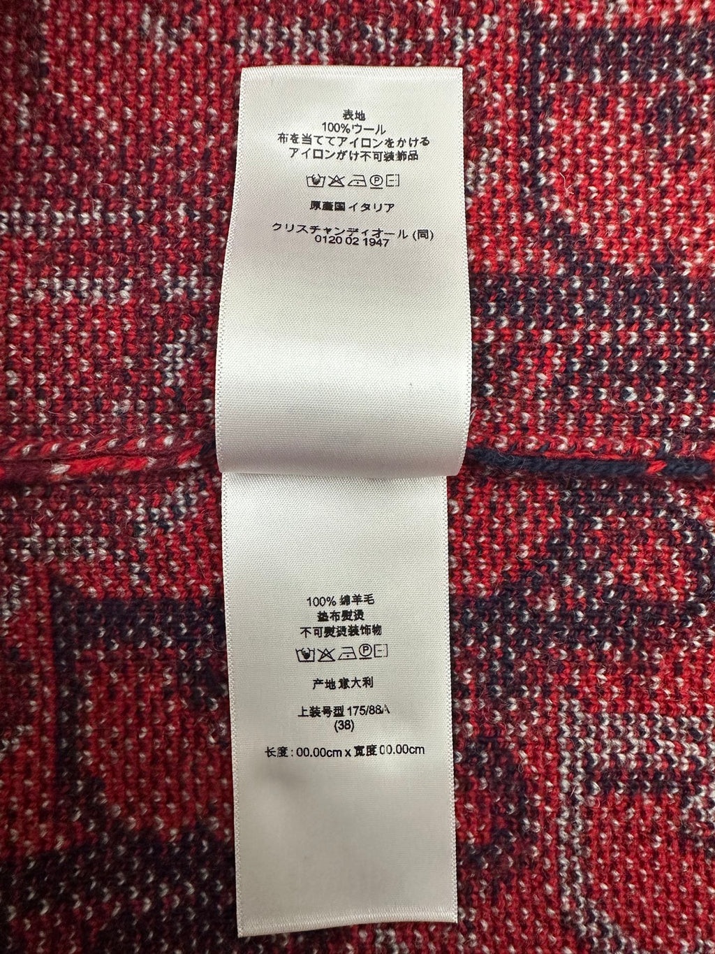 Dior sweater care label tag with fiber composition and washing instructions