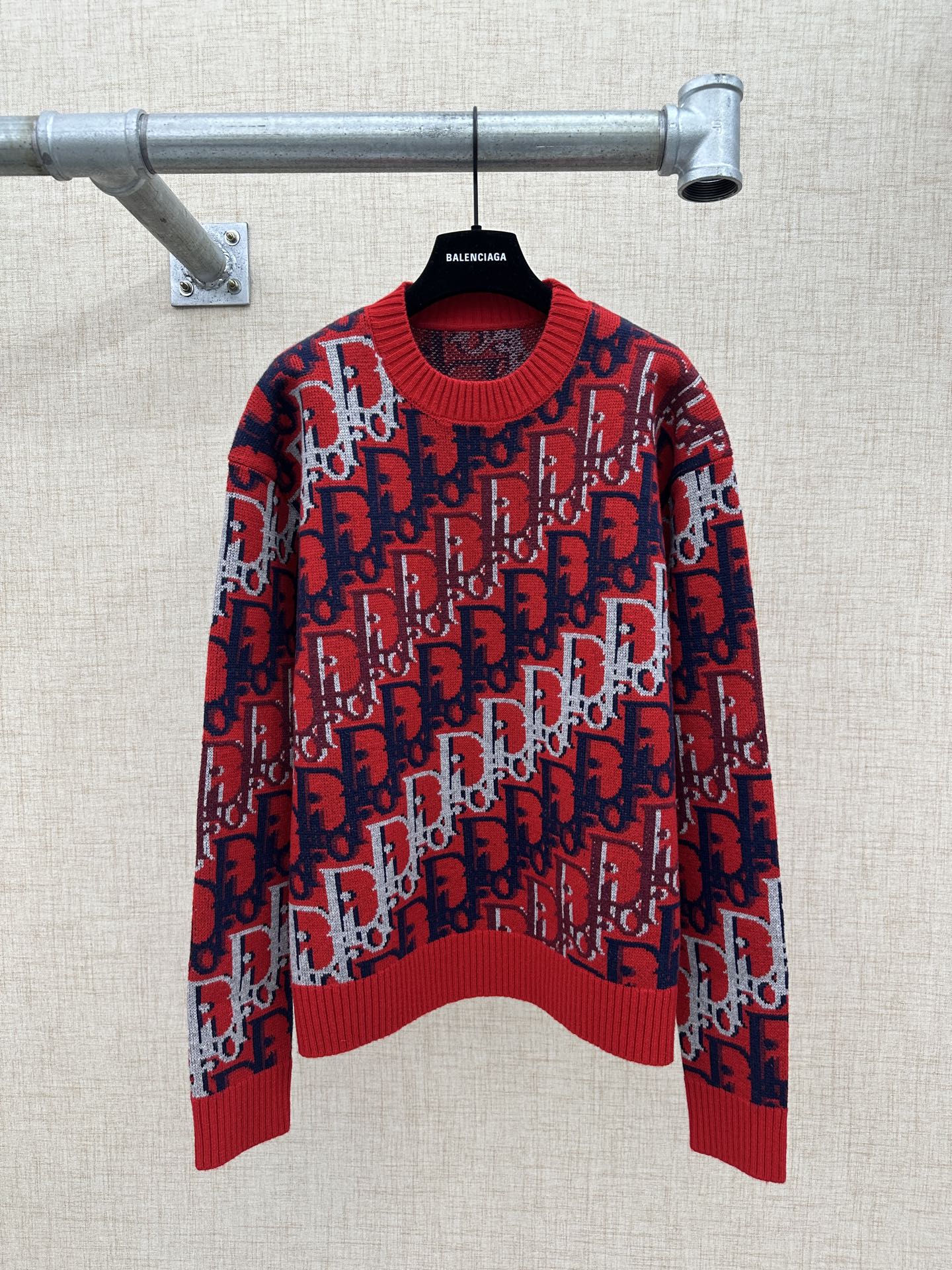 Dior knit sweater in red and navy with allover logo pattern and ribbed collar