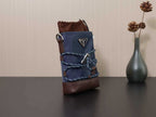 Prada mini crossbody bag in dark blue with brown bottom and triangular front logo