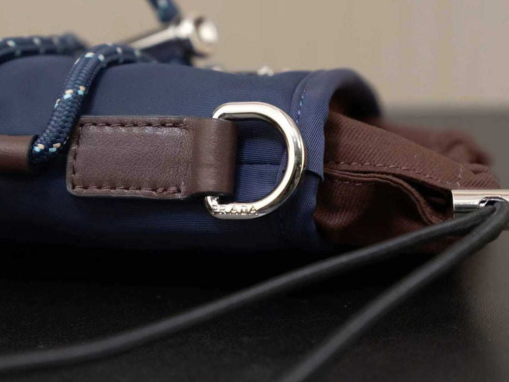 Prada bag strap with brown leather loop and large silver ring buckle detail