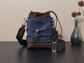 Prada crossbody bag in dark blue with brown leather trim and adjustable strap