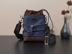 Prada crossbody bag in dark blue with brown leather trim and adjustable strap