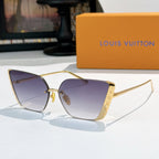 Gold-tone Louis Vuitton sunglasses with gradient blue-violet lenses and cat-eye frames