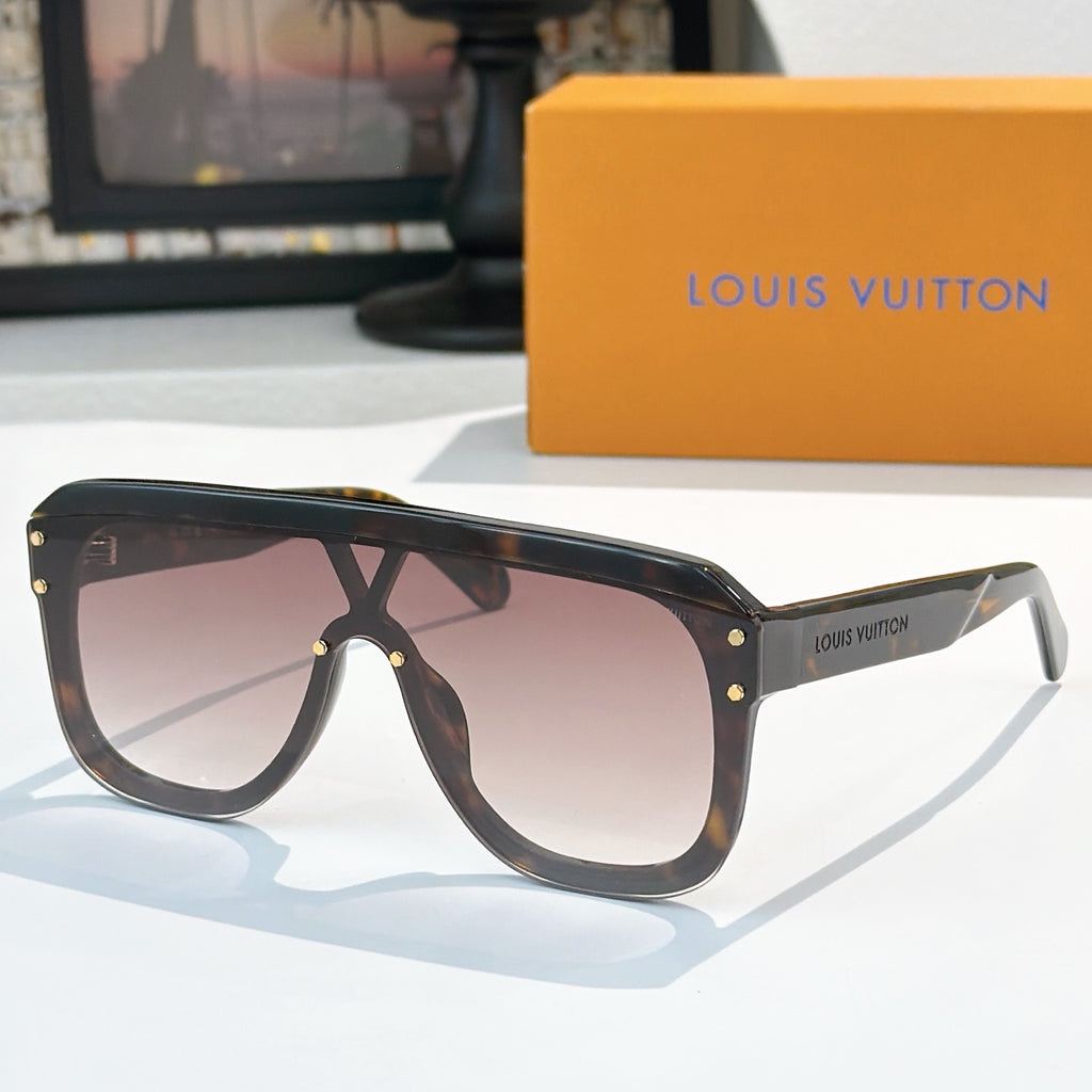 Brown sunglasses with dark lenses, gold-tone rivets, and slim arms