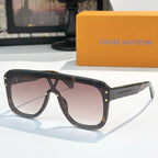 Brown sunglasses with dark lenses, gold-tone rivets, and slim arms