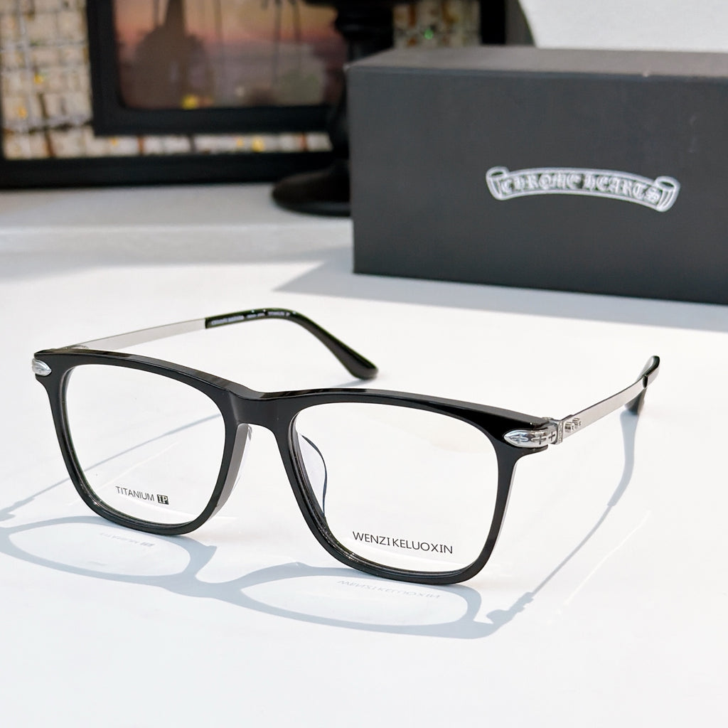 Clear-lens eyeglasses with black frames and metal details.