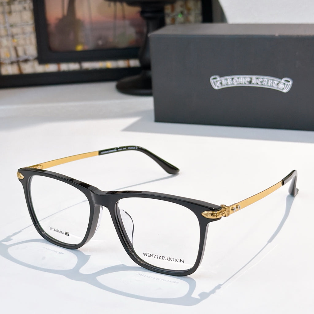 Black and gold eyeglasses with clear lenses, rectangular frames.
