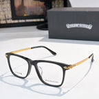 Black and gold eyeglasses with clear lenses, rectangular frames.