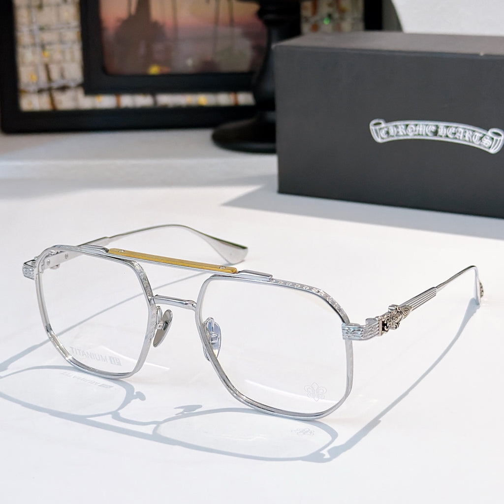 Silver-tone eyeglasses with clear lenses, thin metal frame, textured temple detail.