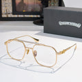 Gold-tone eyeglasses with clear lenses and thin metal frame, detailed temple.