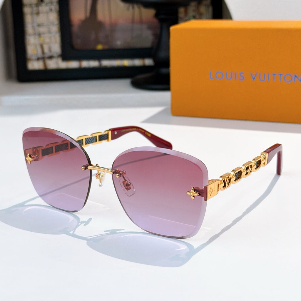 Designer sunglasses with rose gradient lenses and gold link temples