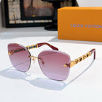 Designer sunglasses with rose gradient lenses and gold link temples