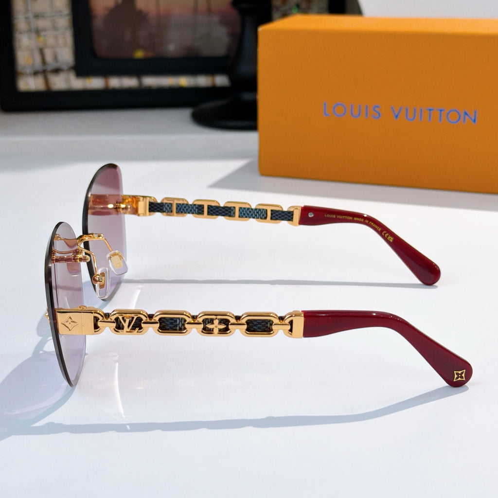 Designer sunglasses side view with red temples and gold link frame