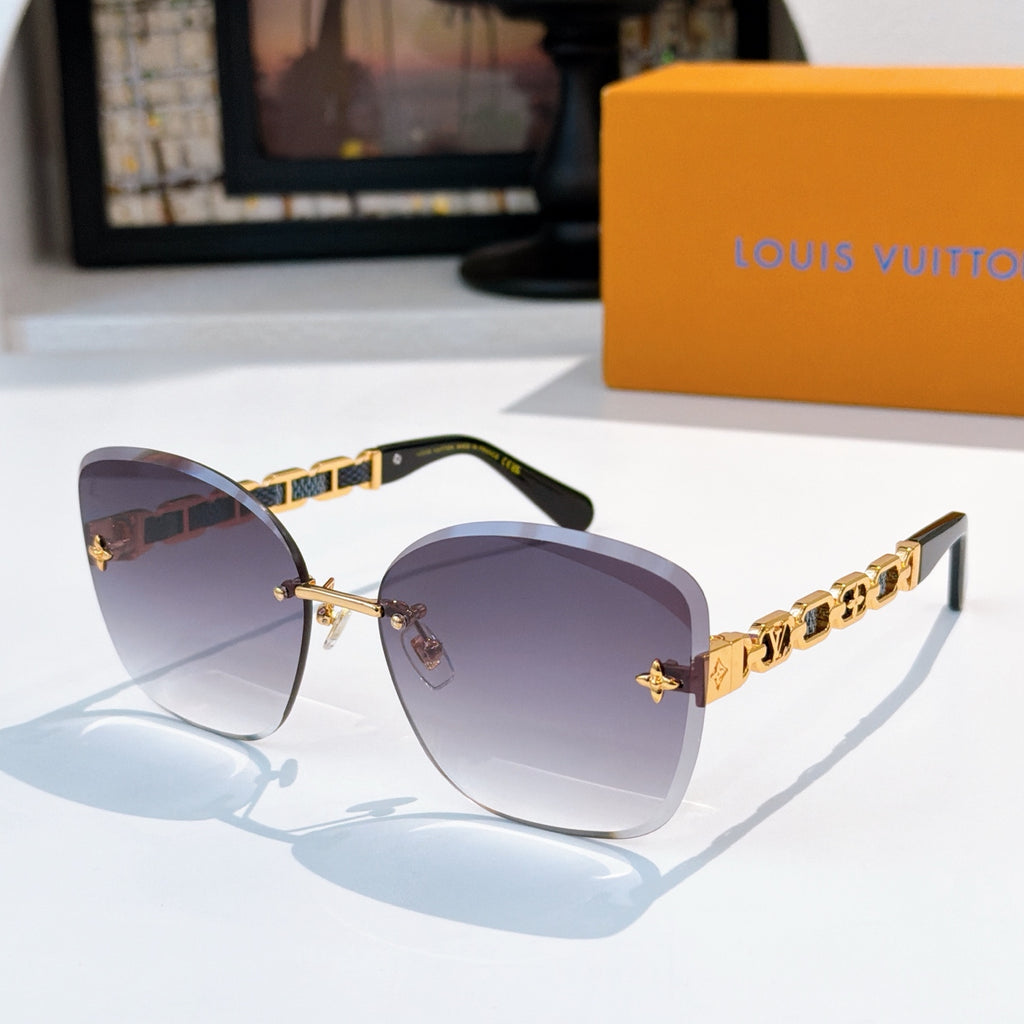 Designer sunglasses with purple gradient lenses and gold link temples