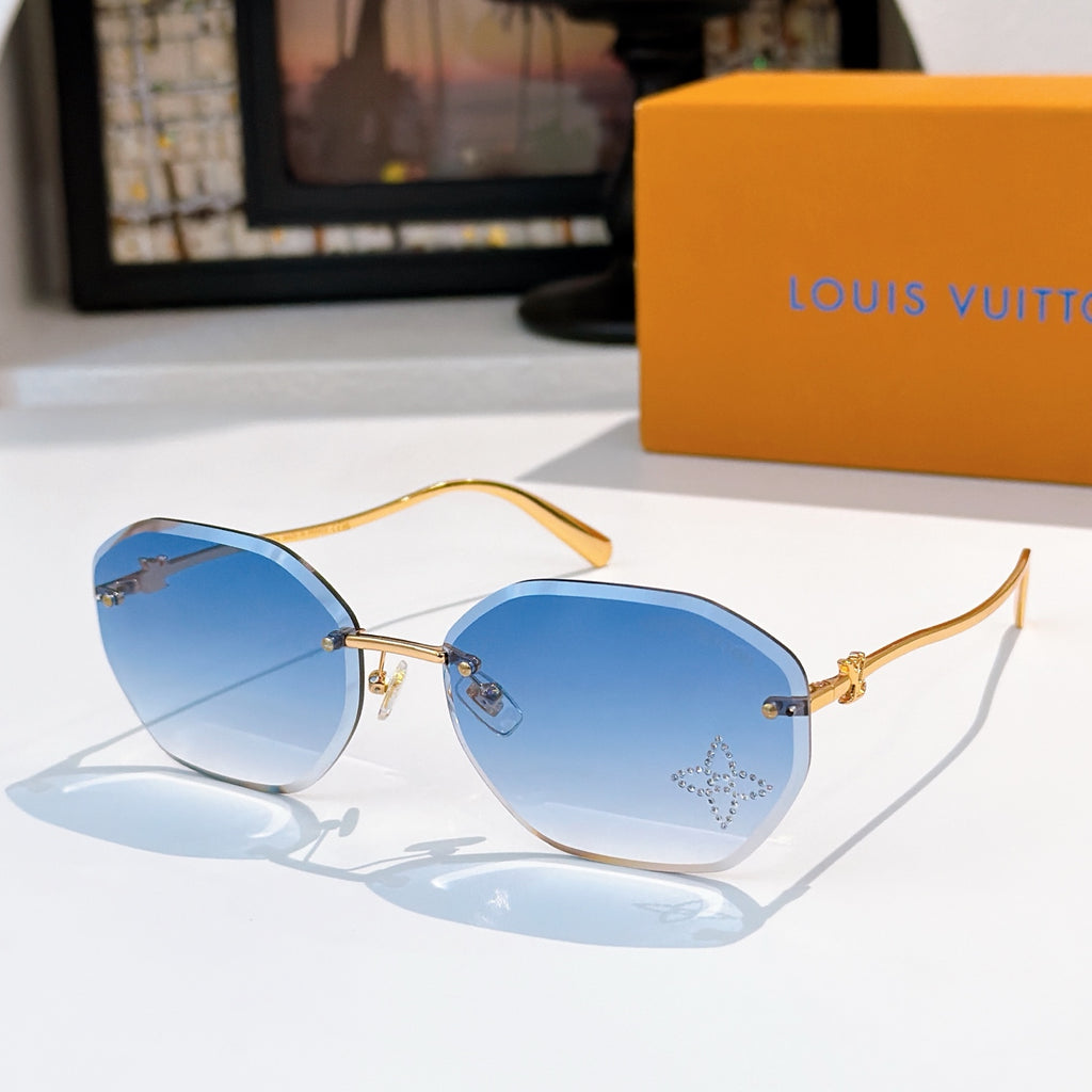 Louis Vuitton gold sunglasses with blue lenses, round cat-eye frame