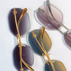 Louis Vuitton gold-rimmed sunglasses with dark lenses, assorted frames shown
