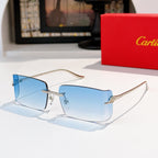 Cartier sunglasses with light blue gradient lenses, gold metal frame, rectangular